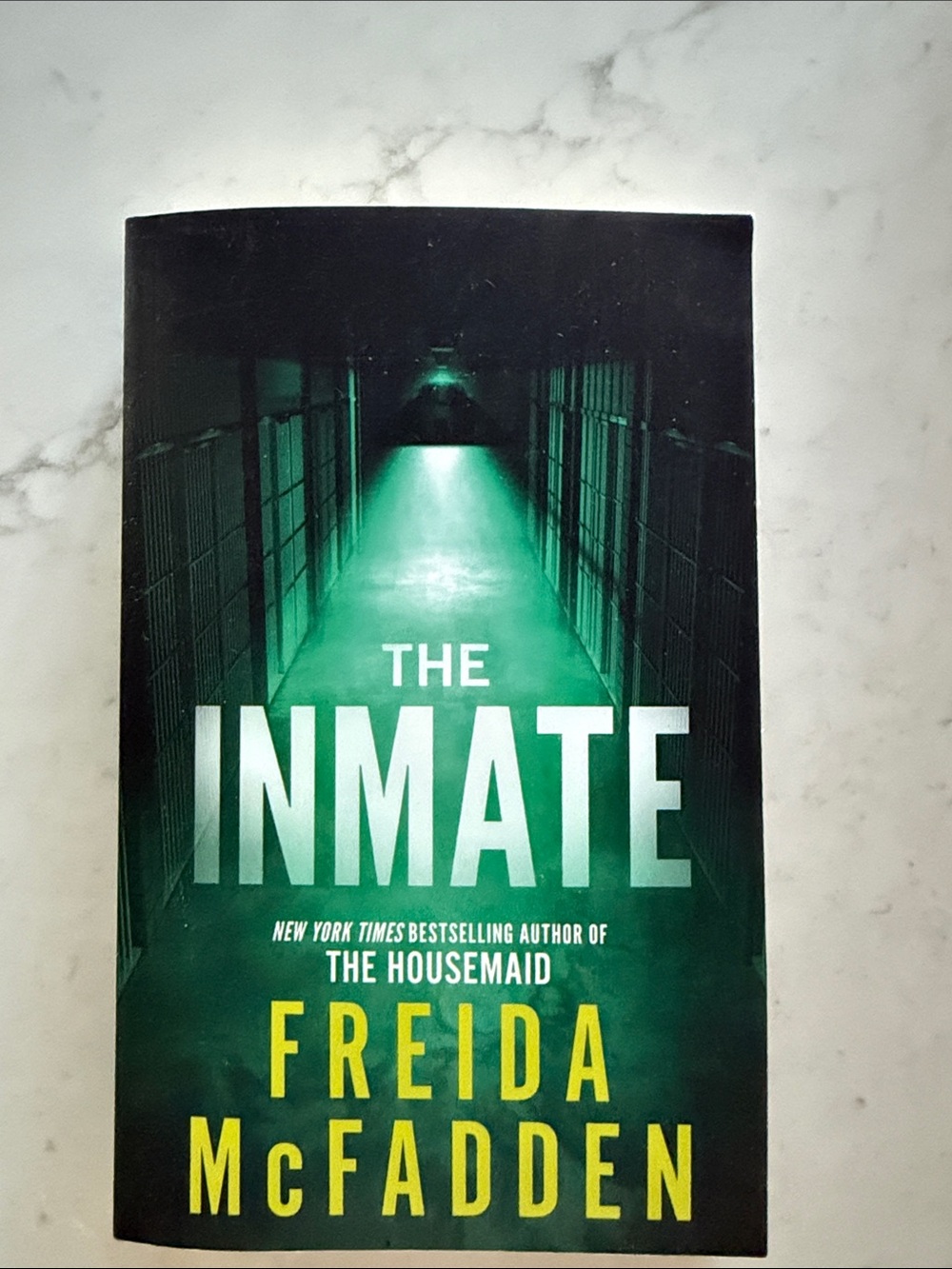 The Inmate by Freida McFadden - Green & Black Thriller Paperback